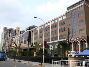 a large building on a city street with at Jie Hao Royal Hotel in Fenghuangwei