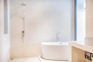 a white bathroom with a tub and a shower at Villa Azure in Koh Samui  +38 photos