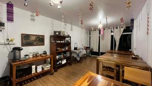 a room with a room with a table and a room with a table at OldTown Boutique House Sukhothai in Sukhothai