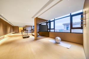 Ένα ή περισσότερα κρεβάτια σε δωμάτιο στο JI Hotel Shanghai Chongming Changxing Island