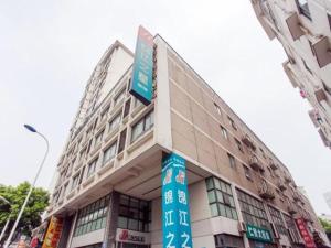 a building with blue signs in front of it at Jinjiang Inn Changzhou, Tianning Temple in Changzhou