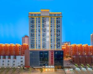 a rendering of a tall building in a city at James Joyce Coffetel·Bao Ji Gao Tie Nan Zhan in Baoji
