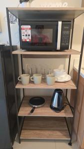 Kuchyň nebo kuchyňský kout v ubytování 8 Adriatico Condotel Unit Facing Manila Bay