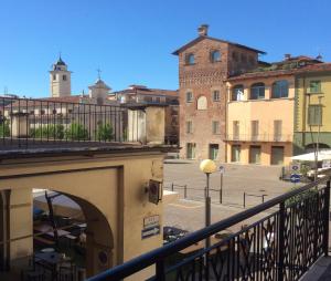 a view of a city from a balcony at Lilly Rose Apartment in Alba