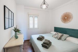 a bedroom with a bed with towels on it at Vista Marina de Isla Canela in Isla del Moral