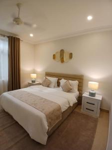 Giường trong phòng chung tại Premier Hotel Zanzibar Airport