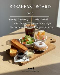 a breakfast board with bread bread and salad and dips at Ratana Hotel Sakdidet, PHUKET TOWN in Phuket Town