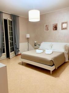 Postel nebo postele na pokoji v ubytování VILLA GIUDICE Luxury Home + 11 fotografií