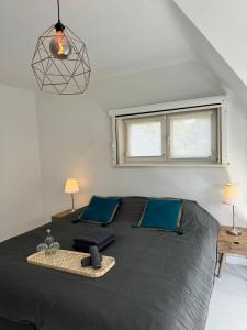 Postel nebo postele na pokoji v ubytování charmante vakantiewoning nabij Brugge