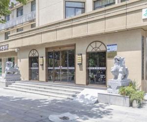 a building with two statues in front of it at James Joyce Coffetel· Hefei Anhui Agricultural University in Hefei