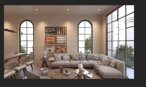 a living room with a couch and a table at Mui Ne Villa - Tiến Thành in Bình Sum