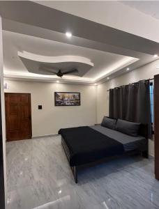 Ένα ή περισσότερα κρεβάτια σε δωμάτιο στο Bob's Guest House