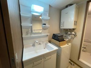 Η κουζίνα ή μικρή κουζίνα στο ホロムア澄川 +33 φωτογραφίες