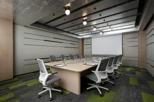 a conference room with a table and chairs and a whiteboard at YOUNG Hotel Guilin -Mixc Mall in Guilin