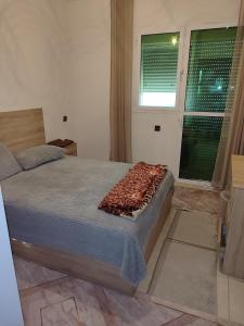 Ένα ή περισσότερα κρεβάτια σε δωμάτιο στο Complexe anakhil Tanger