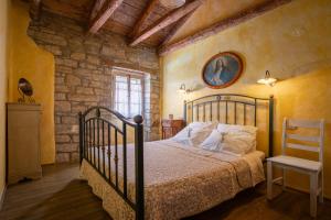 Postel nebo postele na pokoji v ubytování Dobrinja Residence Villas Lopar + 63 fotografií