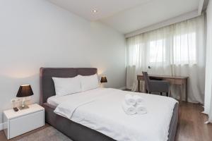 Posteľ alebo postele v izbe v ubytovaní Oxygen Residence