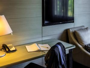 TV a/nebo společenská místnost v ubytování Pullman Brisbane King George Square + 125 fotografií