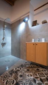 a bathroom with a sink and a mirror at stonebuilt HiddenHouse in Paphos +27 photos