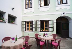 
a dining room table set with chairs and tables at Pension Dientzenhofer in Prague
