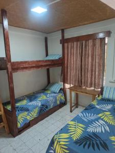 Ένα ή περισσότερα κρεβάτια σε δωμάτιο στο Cozy Blooms