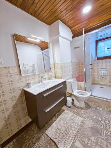 a bathroom with a sink and a toilet at Lou Barry in Lassouts