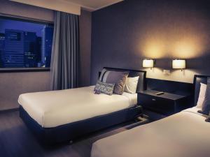 Postel nebo postele na pokoji v ubytování Mercure Santiago Centro