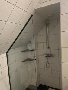 a shower with a glass door in a bathroom at Central Apartment Stavanger 2 Bedroom Sleeps 4 in Stavanger +30 photos