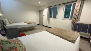 a hospital room with a bed and a couch at WAKE UP @Lanta Hotel : Cafe in Ko Lanta +94 photos