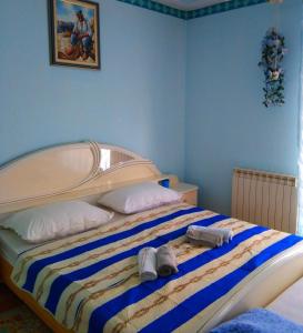 Ένα ή περισσότερα κρεβάτια σε δωμάτιο στο Apartments Vesna