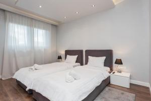 Posteľ alebo postele v izbe v ubytovaní Oxygen Residence