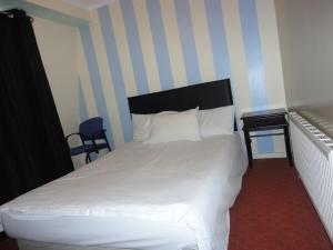 Postel nebo postele na pokoji v ubytování City View Hotel