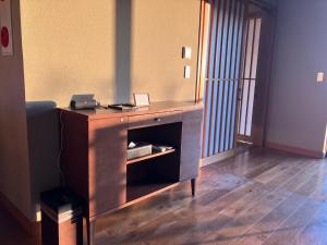 a dresser with a mirror in a room at TOKI Resort HAKONE BETTEI in Hakone