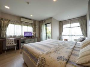 Ένα ή περισσότερα κρεβάτια σε δωμάτιο στο Apartments in the NICE condominium on Bang Tao Beach