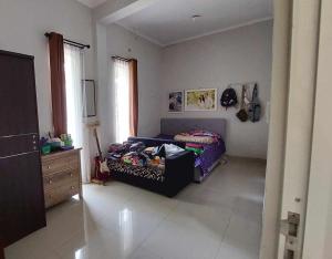 Postel nebo postele na pokoji v ubytování homestay elisa dekat bromo