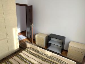 a living room with a tv and a table with a rug at Old Center Apartment in Craiova +2 photos