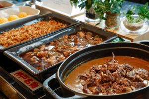 a table with two trays of food on a table at KOKO HOTEL Kobe Sannomiya in Kobe