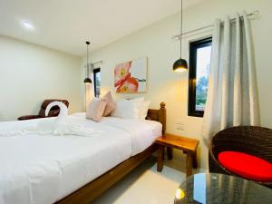 Ένα ή περισσότερα κρεβάτια σε δωμάτιο στο Grand' Pa HomeStay