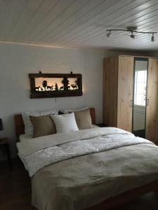 a bedroom with a large bed in a room at Im Toggi in Wattwil