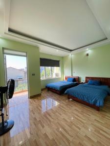 Postel nebo postele na pokoji v ubytování Nhà Nghỉ Hải Dũng