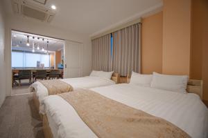 Postel nebo postele na pokoji v ubytování INOVE VILLA Osaka