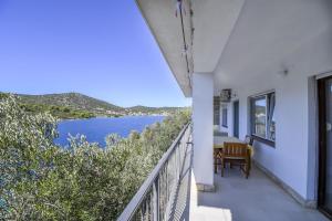 a balcony with a view of the water at Apartments Ivan in Vinišće