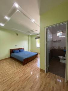 Postel nebo postele na pokoji v ubytování Nhà Nghỉ Hải Dũng + 6 fotografií