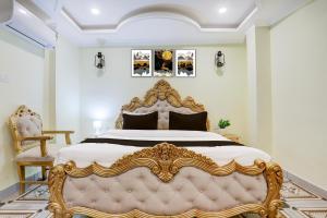 a bedroom with a gold bed and a chair at Palette Heritage Varanasi Retreat in Varanasi