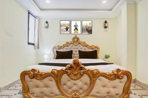 a bedroom with a gold bed in a room at Palette Heritage Varanasi Retreat in Varanasi