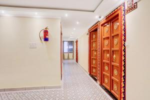 a corridor of a room with a door and a hallway at Palette Heritage Varanasi Retreat in Varanasi +28 photos