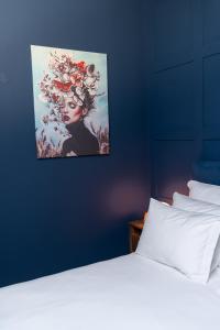 Ένα ή περισσότερα κρεβάτια σε δωμάτιο στο Hotel Kodawari Residences Flores