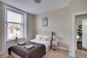 Voodi või voodid majutusasutuse Large 6BR Home Parking Near Arbroath Beach toas