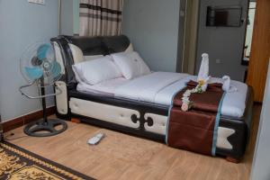 Postel nebo postele na pokoji v ubytování Jebel Hotel & Lounge Buloba