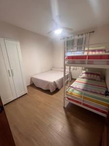 a bedroom with two bunk beds and a closet at Chalet Playa Paraiso in Cádiz +8 photos
